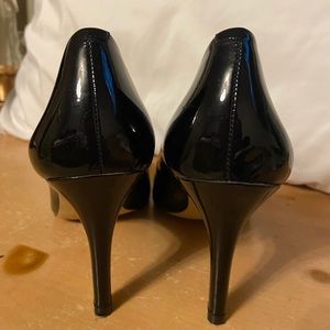 Black patent leather high heel shoes